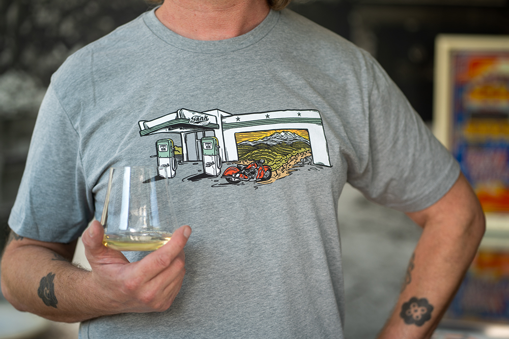 Aaron sporting our new Wild Tribute tee in Heather Grey, featuring our tasting room.