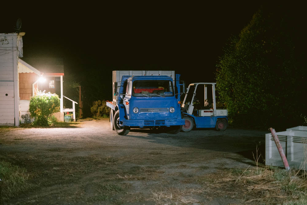 Blue truck at night at farm
