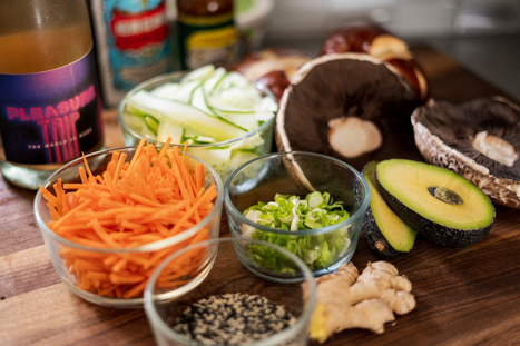 Ingredients for Spicy Miso Mushroom Burgers layed out on a cutting board.