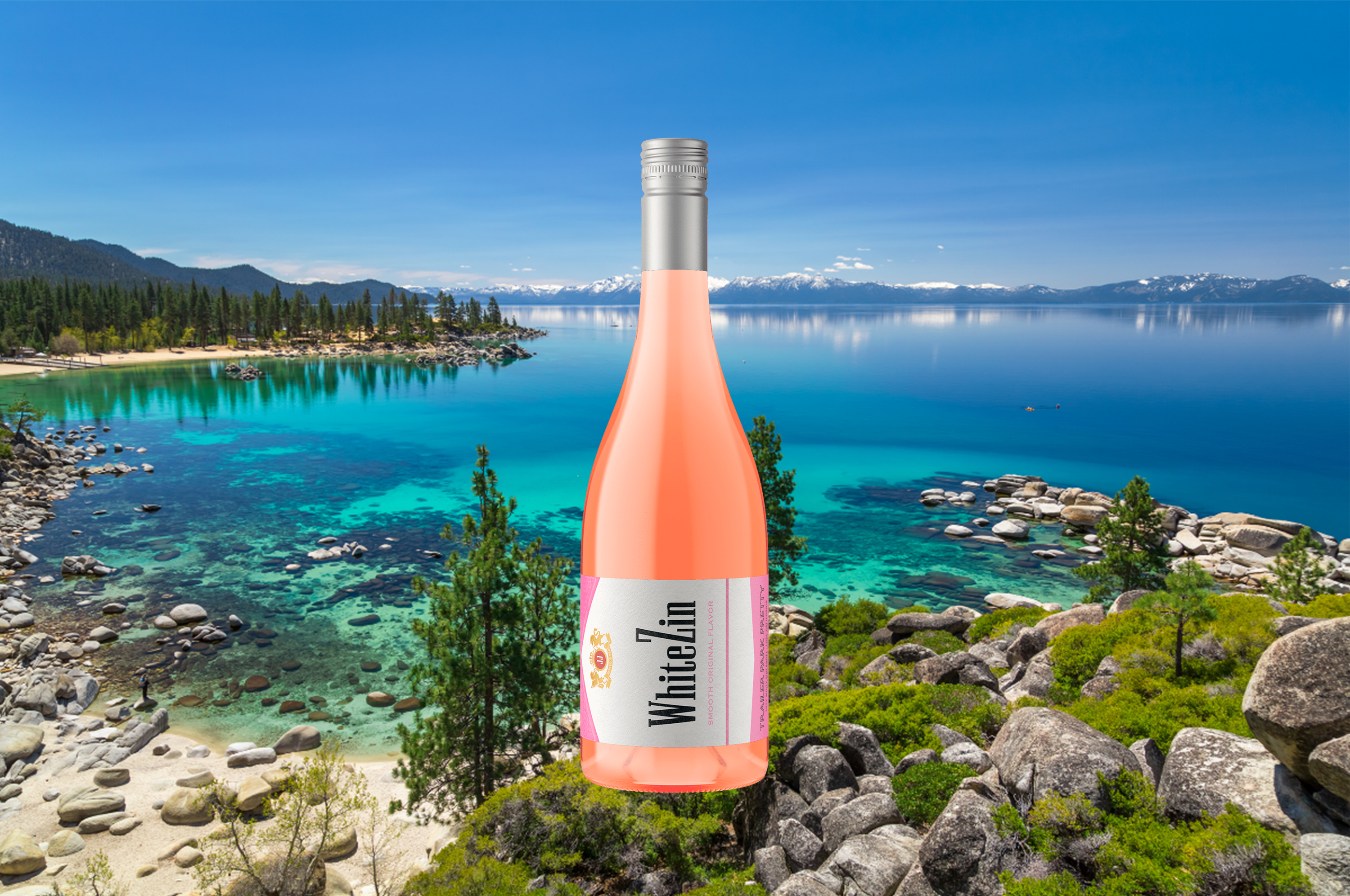 Bottle of Trailer Park Pretty White Zin in front of Lake Tahoe