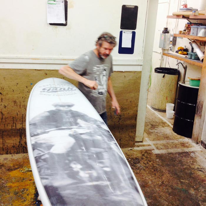 Man making surfboard