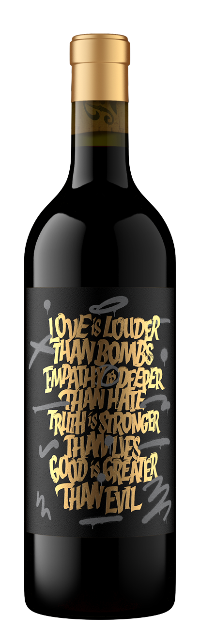 Love Is Louder Than Bombs bottle featuring gold graffiti text on a black background. 